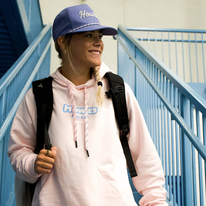 Pink Hooidie that says Howies in blue letters