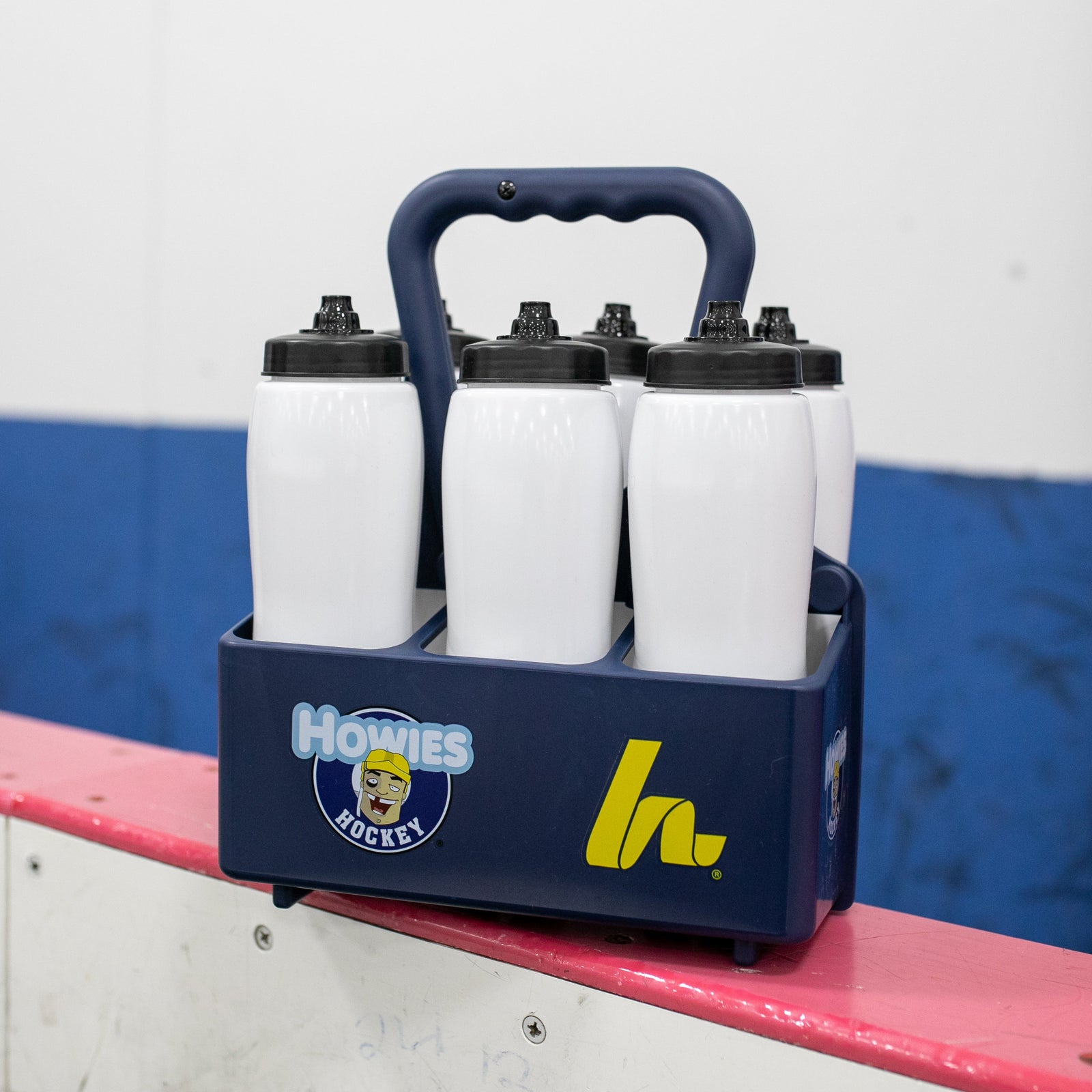 white water bottles in a water bottle carrier