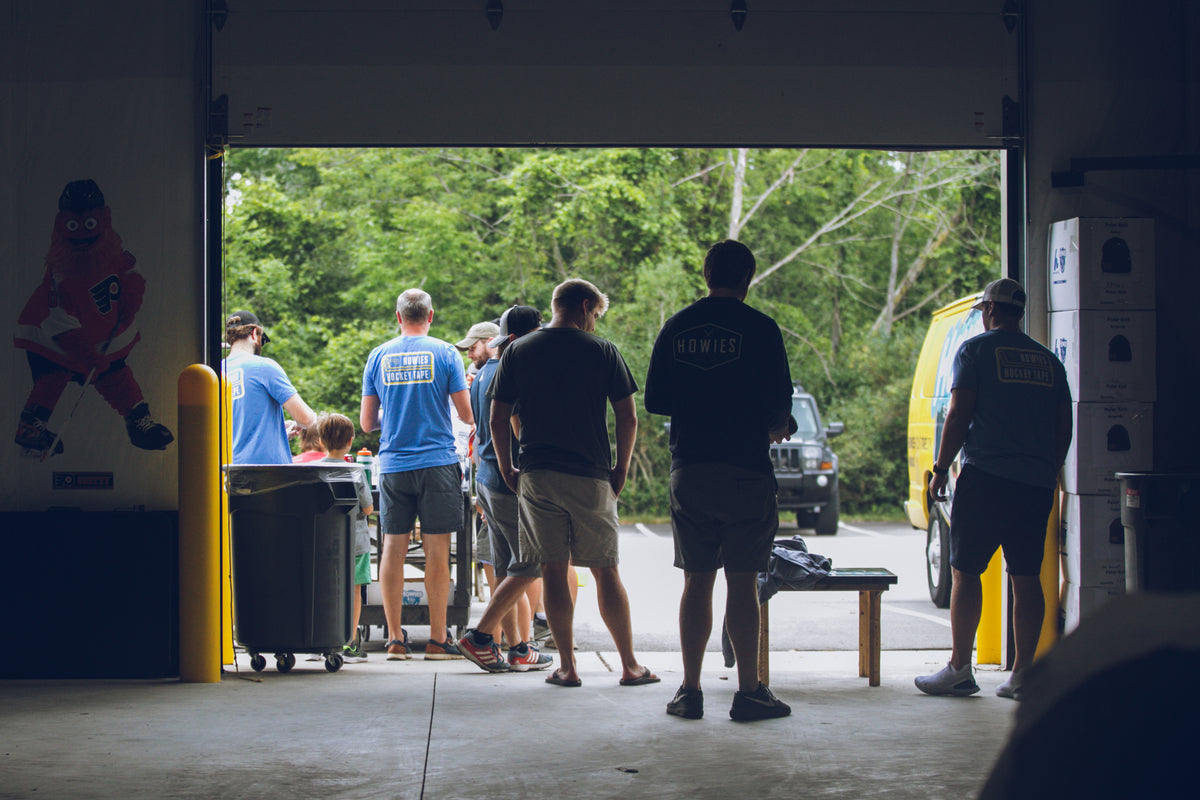 Group of people standing in a warehouse