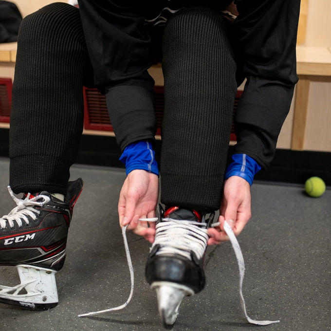 Black hockey knit socks on a player
