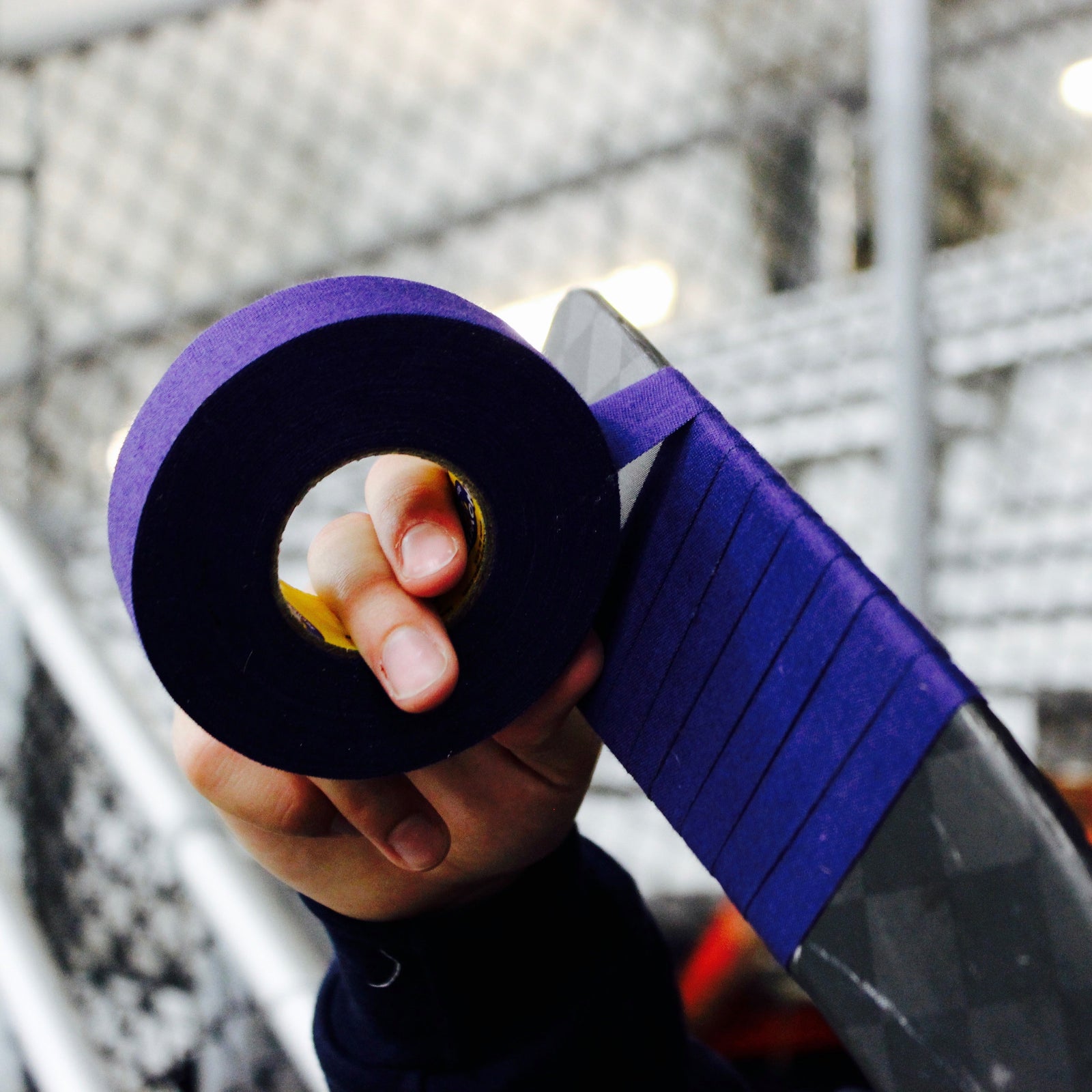 Person using purple tape 