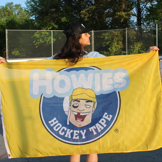Woman Holding Howies Flag 