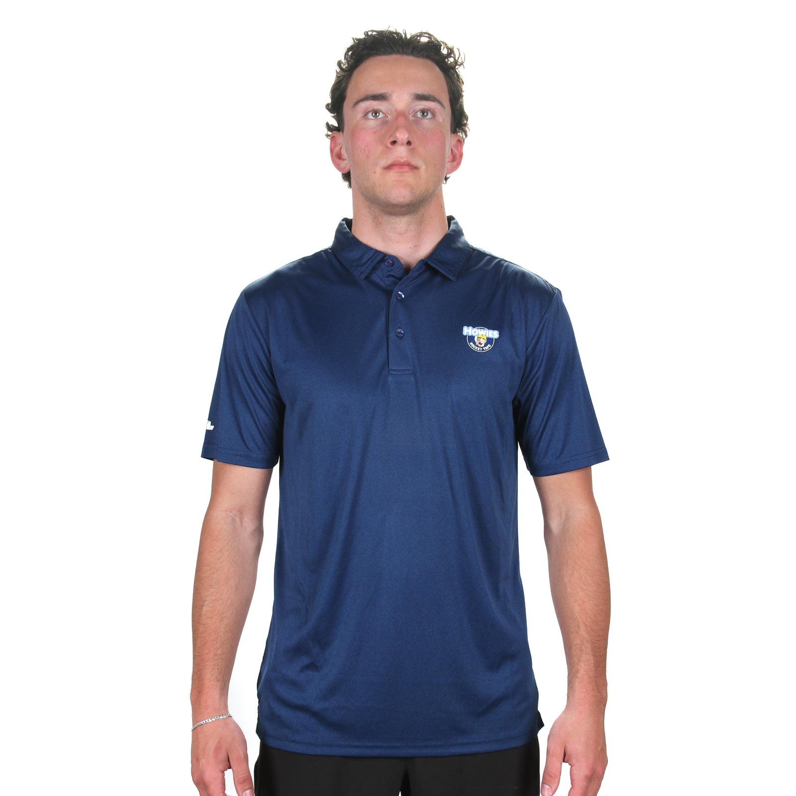 Man wearing nacy Polo with howies logo on breast 