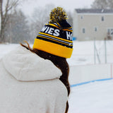 Women wearing navy and yellow beanie 